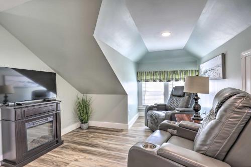 a living room with a couch and a fireplace at Old Orchard Beach Apartment - Quick Walk to Beach! in Old Orchard Beach