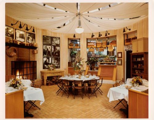 a dining room with a table and chairs in it at Tally Ho Inn in Carmel