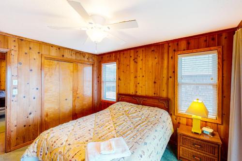 a bedroom with a bed and a ceiling fan at Harper House #4BB in Buxton