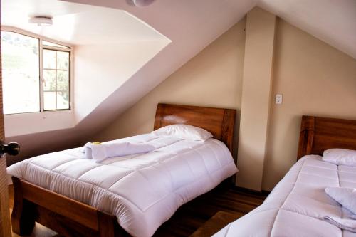 Postel nebo postele na pokoji v ubytování Hotel Imperial Zumbahua & Quilotoa Lodge
