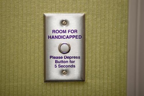 a room for handicapped sign on a wall at Holiday Inn Express Hotel & Suites Longmont by IHG in Longmont