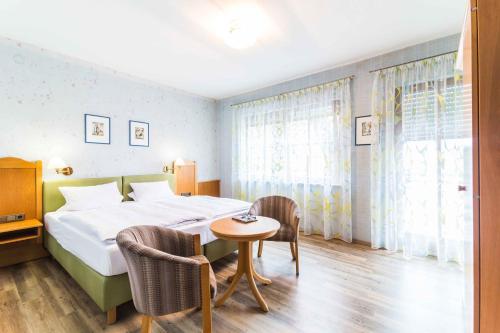 Postel nebo postele na pokoji v ubytování Hotel Braun