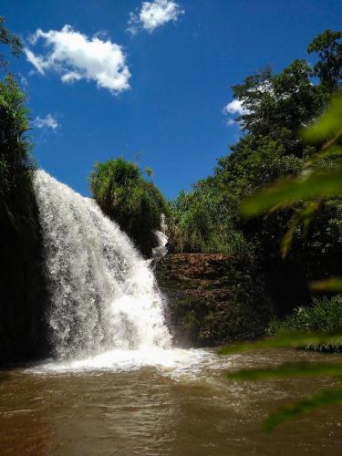 a waterfall on the side of a river at Hotel Manacá in Sacramento