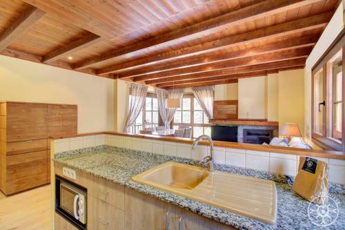 a kitchen with a sink and a counter top at PEULHA de Alma de Nieve in Baqueira-Beret