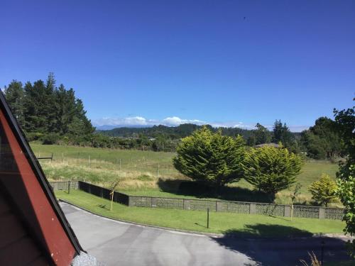 a view from a car of a road with trees at Woodland Glen Lodge B&B in Hokitika