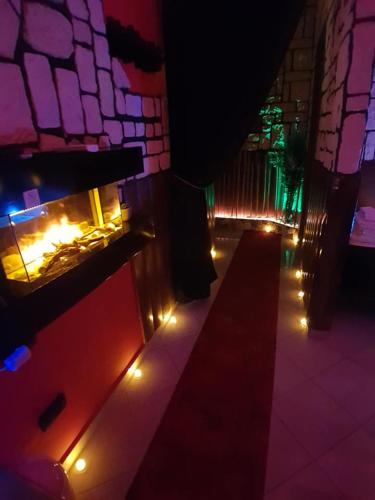 a lit up room with a fireplace with lights at B&B Ginevra 2 in Naples