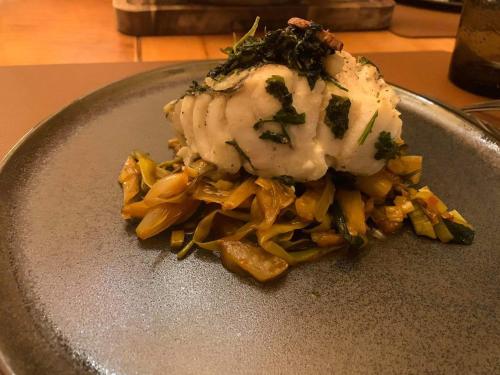 a plate of food with pasta and ice cream on it at Das gemütliche Dorfhotel Kaltenhauser in Hollersbach im Pinzgau