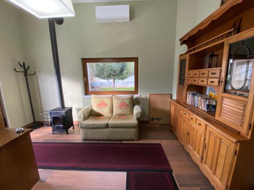 a living room with a couch and a window at Guesthouse Tershana in Peshkopi