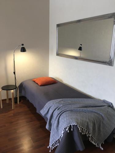 Кровать или кровати в номере StarHomes City Apartment 48