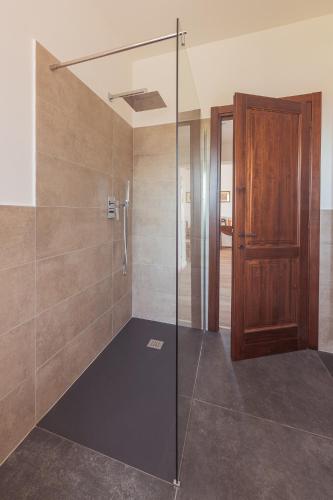 a bathroom with a shower with a glass door at Agriturismo Querceto in Frazione Mocaiana