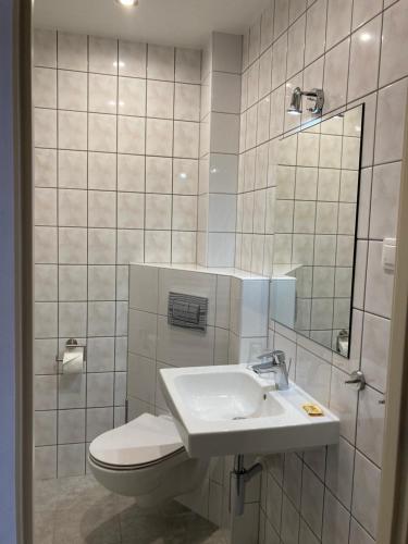 Et badeværelse på Pokoje Gościnne "Willa Mil"