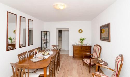 a dining room with a table and chairs at B&B Villa Dubrovnik Garden in Dubrovnik