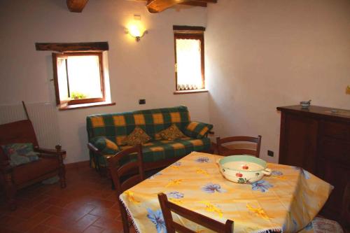 a living room with a table with a bowl on it at Apartment in Montieri/Toskana 38264 in Montieri