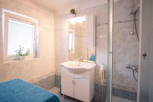 a bathroom with a sink and a shower at Apartment in Vrbnik/Insel Krk 36770 in Vrbnik