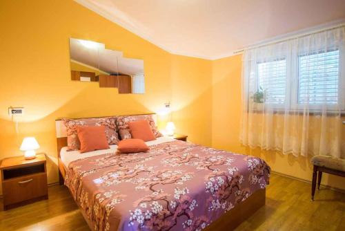a bedroom with a large bed and a window at Apartment in Vrbnik/Insel Krk 36770 in Vrbnik