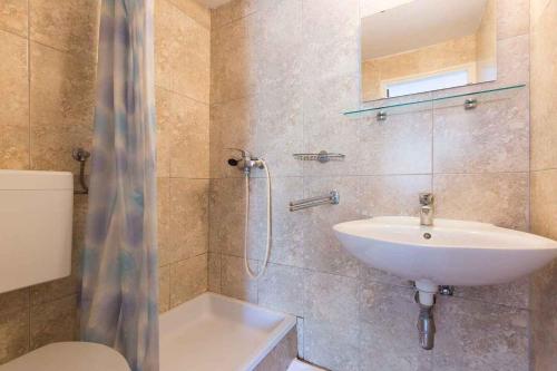 a bathroom with a sink and a toilet and a shower at Studio in Vrbnik/Insel Krk 36776 in Vrbnik