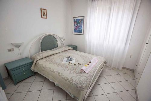 Ένα ή περισσότερα κρεβάτια σε δωμάτιο στο Apartment in Rosolina Mare 25066