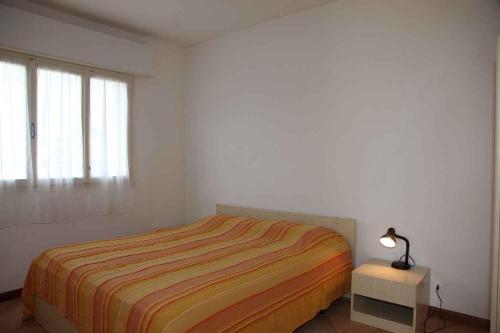 Postel nebo postele na pokoji v ubytování Apartments in Bibione 25582