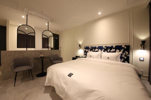 Giường trong phòng chung tại Zam101 Hotel Gimhae