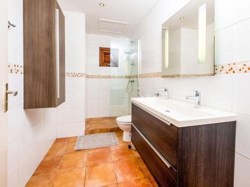 a bathroom with a sink and a toilet at Pool Villa near Jan Thiel in Jan Thiel