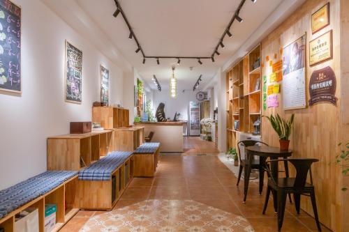 a room with benches and tables in a store at Xi'an Travelling with Hotel South Gate in Xi'an