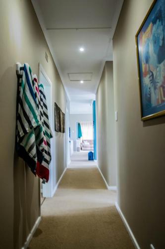 a hallway leading to a room with a hallwayngth at Die Strandhuis - Stilbaai in Stilbaai