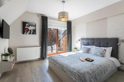 Posteľ alebo postele v izbe v ubytovaní Apartament PAULA Zakopane