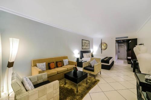a living room with a couch and a table at The Zuri White Sands, Goa Resort & Casino in Varca