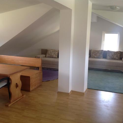 a living room with a couch and a window at Apartments Baba Luce in Strica
