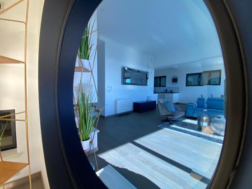 a view of a living room through a mirror at The View Luxury Residence with Pool in Zadar