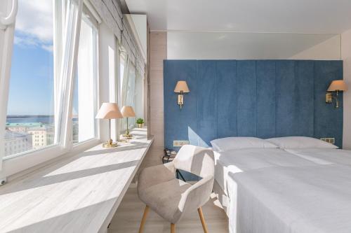 Postel nebo postele na pokoji v ubytování Представительский этаж гостиницы Двина