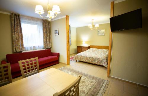 Ein Bett oder Betten in einem Zimmer der Unterkunft Taujėnų dvaro svečių namai