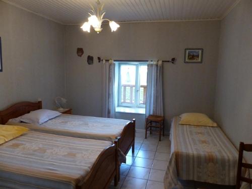 Łóżko lub łóżka w pokoju w obiekcie le Chaumois