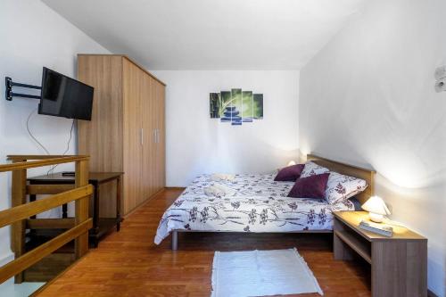 מיטה או מיטות בחדר ב-Šibenik Soul