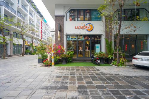 a building with a store on a city street at BBQ HOSTEL in Ha Long
