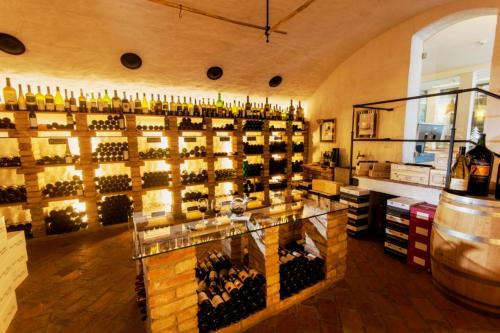 a room filled with lots of bottles of wine at Hotel Enzian - Adults Only in Obertauern