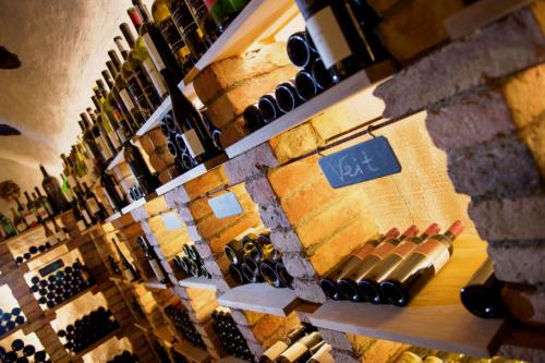 a wine store with a bunch of bottles of wine at Hotel Enzian - Adults Only in Obertauern