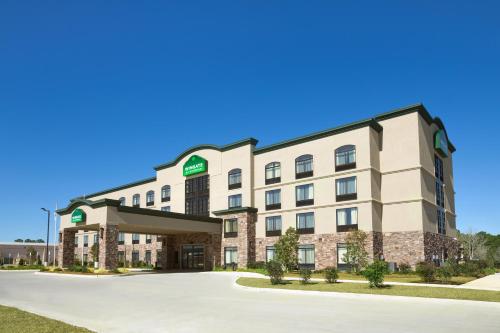 a rendering of a hotel building with a driveway at Wingate Slidell New Orleans in Slidell