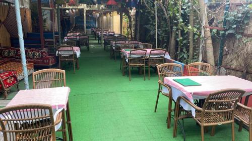 a row of tables and chairs on a patio at Garden House in Istanbul