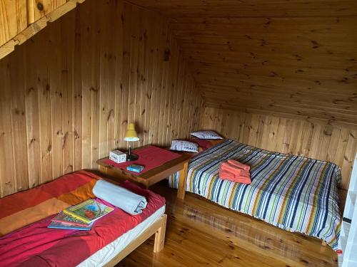 Un pat sau paturi într-o cameră la Dom Pod Sosnami