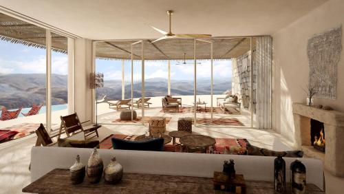 a living room with a view of the mountains at Six Senses Shaharut in Shaharut