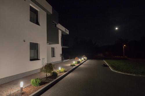 an empty street at night with a building at Apartments Dora Sveti Martin na Muri in Sveti Martin na Muri