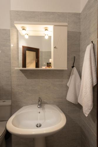 a bathroom with a sink and a mirror at Villa Georgia in Kalyves
