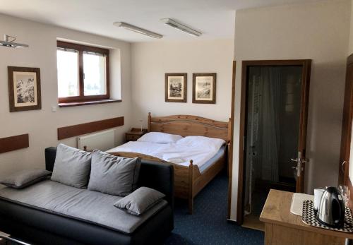 Posteľ alebo postele v izbe v ubytovaní Tatrahouse Apartments