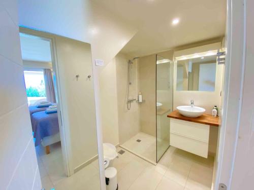 a bathroom with a glass shower and a sink at Paleopetres K-Five - Premium Double Suite - Kalami - in Kalami