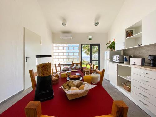 a kitchen with a table with food on it at Albergue da Juventude in Tancos