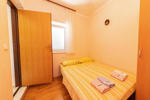 Ένα ή περισσότερα κρεβάτια σε δωμάτιο στο Apartmens Mendula