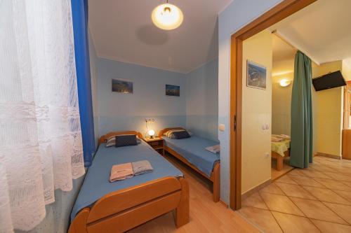 Ένα ή περισσότερα κρεβάτια σε δωμάτιο στο Apartmens Mendula