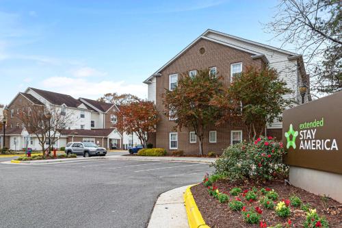 a building with a sign in a parking lot at Extended Stay America Suites - Norfolk - Virginia Beach in Virginia Beach