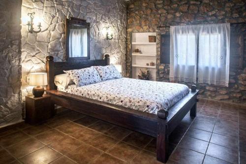 Säng eller sängar i ett rum på Mas de les Garroferes